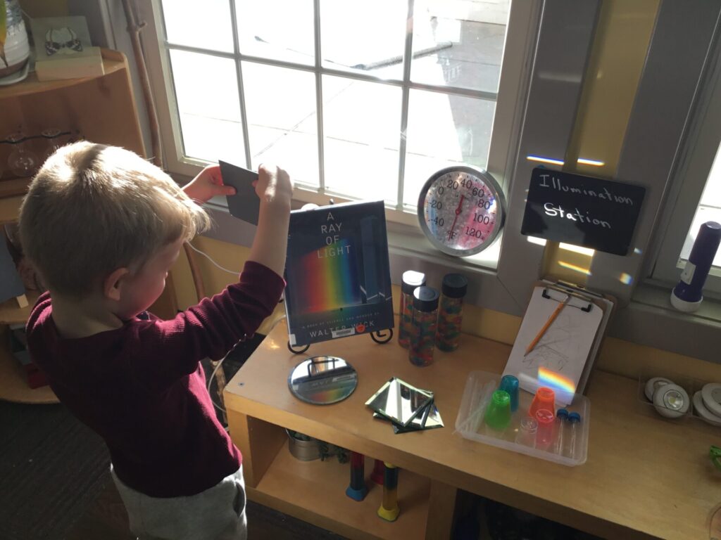 Toledo-area preschool students exploring a Reggio-inspired lesson on lights and shadows