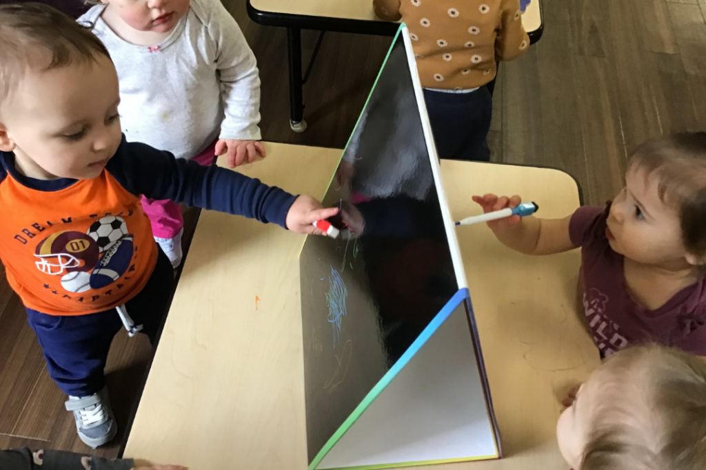 Toledo toddler program students painting for Week of the Young Child