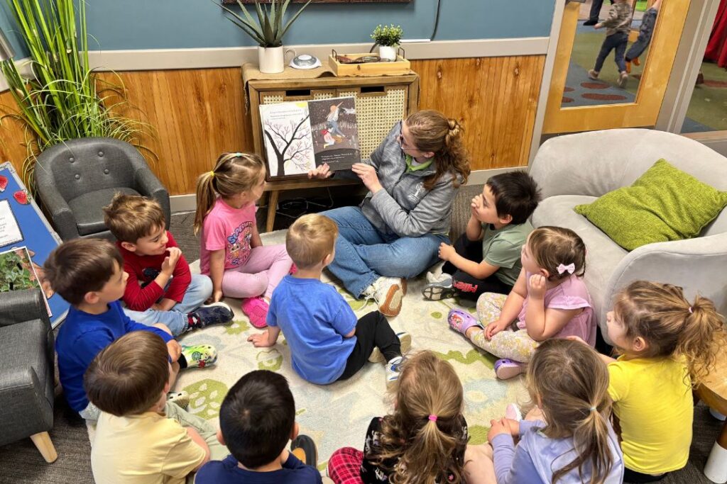 CDC Pre-K teacher Ms. Nicole reading to her early learning students