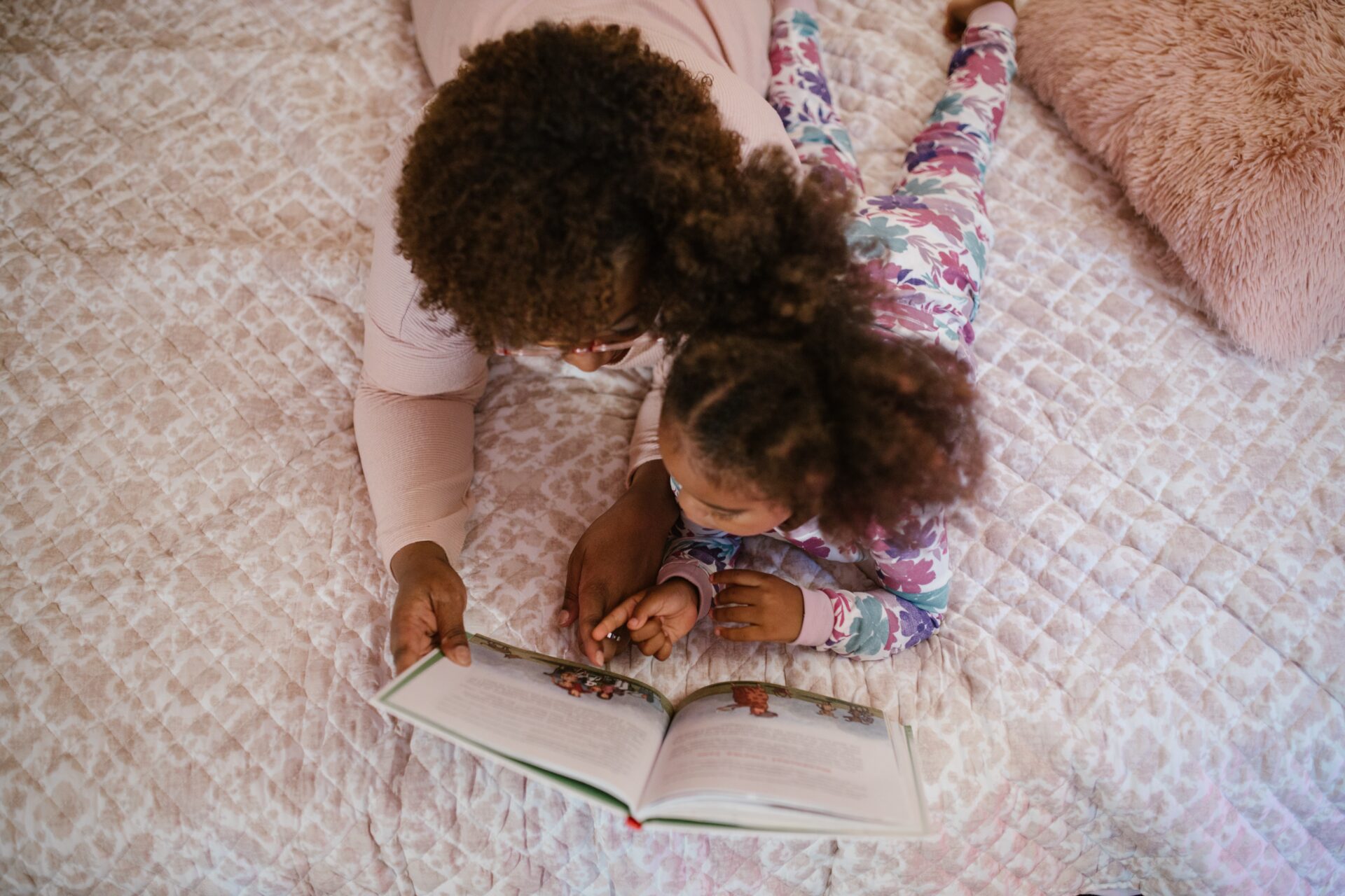 Mother and child reading together